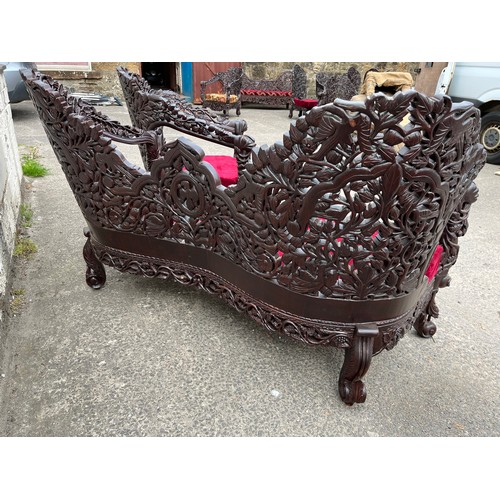 384 - an asian highly carved sofa & 2 chairs with red velvet upholstery