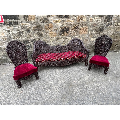 385 - an asian highly carved sofa & 2 chairs with red velvet upholstery