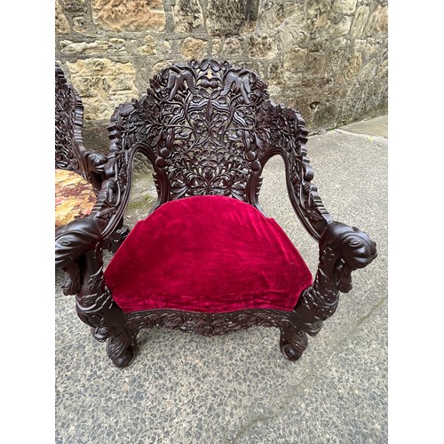 445 - an asian highly carved sofa & 2 chairs with red velvet & floral upholstery 
2 extra cushions include... 