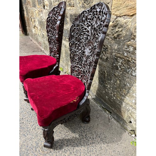 447 - asian highly carved  2 chairs with red velvet upholstery
small tear on one cushion