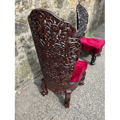 447 - asian highly carved  2 chairs with red velvet upholstery
small tear on one cushion