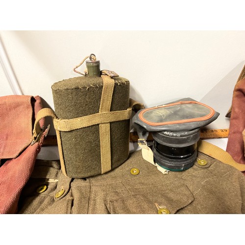 157 - Military jacket & trousers to include gas mask, water bottle & bags.