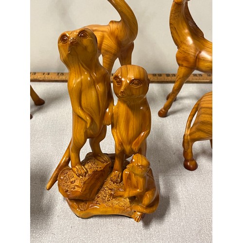 81 - Collection of hand carved wooden animals to include meerkats and bull etc