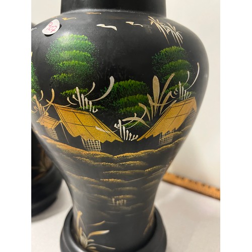 55 - Pair of large black lacquered oriental vases.
38cm h