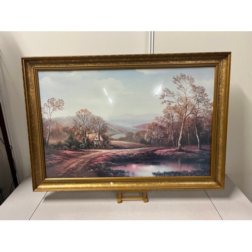 520 - Large gilt framed picture of countryside scene.