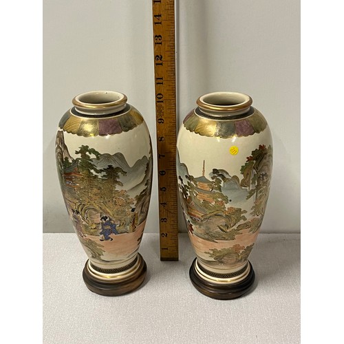 60 - Pair of signed Japanese satsuma vases on wooden stands possibly from the meiji period?
10