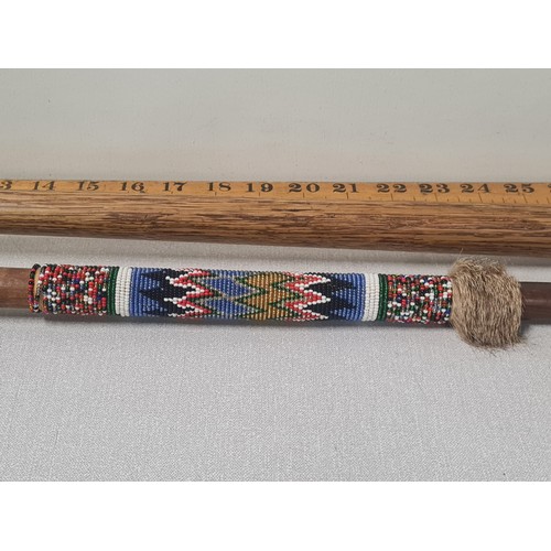 33 - 1 beaded knobkerrie with fur & 1 other.
longest 53cm