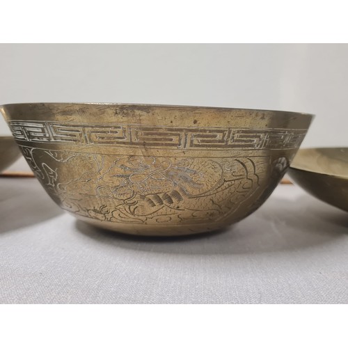 63 - 3 large Chinese brass bowls.