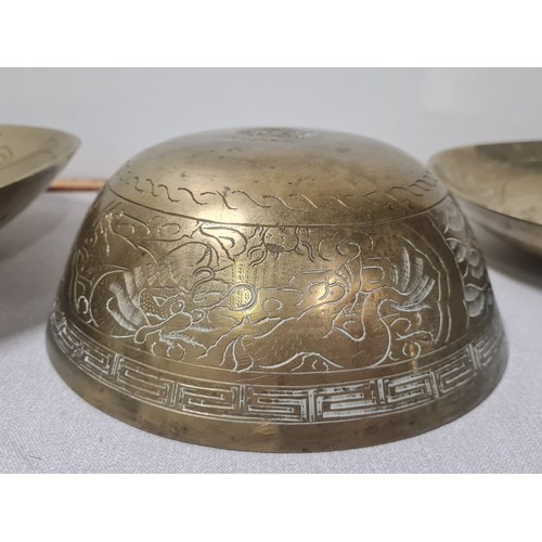 63 - 3 large Chinese brass bowls.