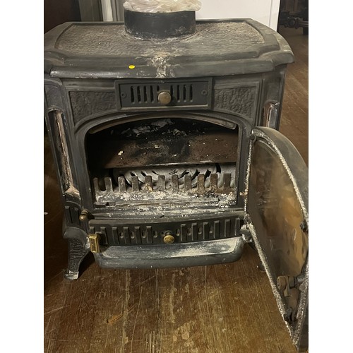 66 - Cast Iron wood burning stove model JA048 weighs 110kg