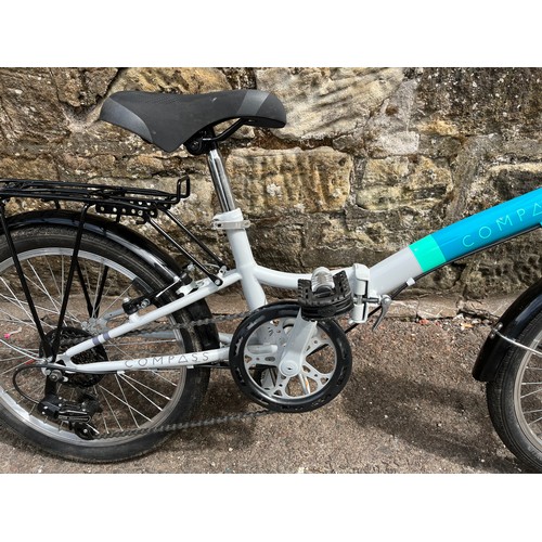 111 - A pair of compass folding bikes nearly new