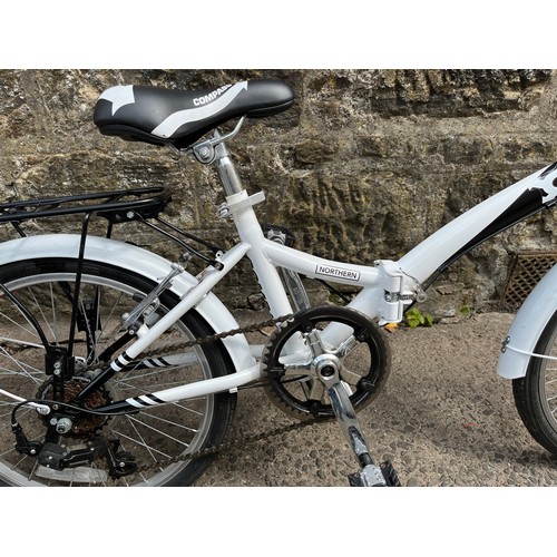 111 - A pair of compass folding bikes nearly new