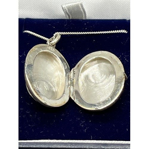 245 - Silver & mother of pearl locket & necklace.