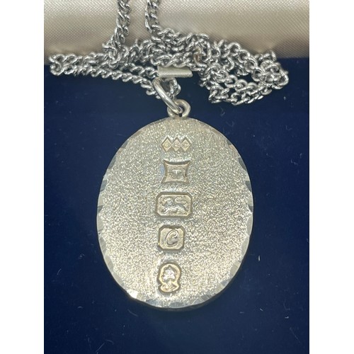 247 - Silver ingot pendant with white metal necklace.