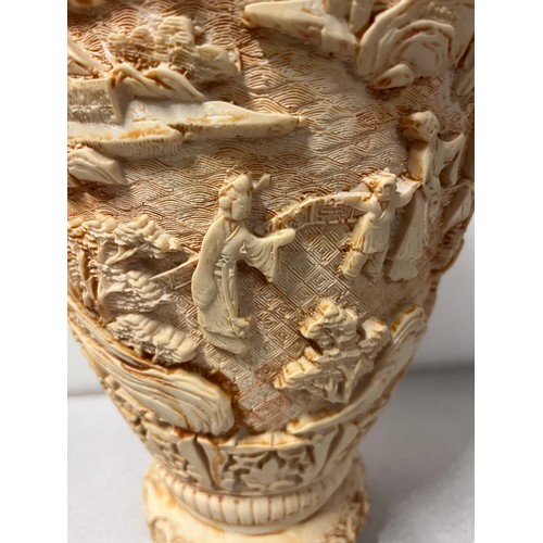 93 - Large alabaster vase depicting Japanese scene with elephant handles.
31cm h