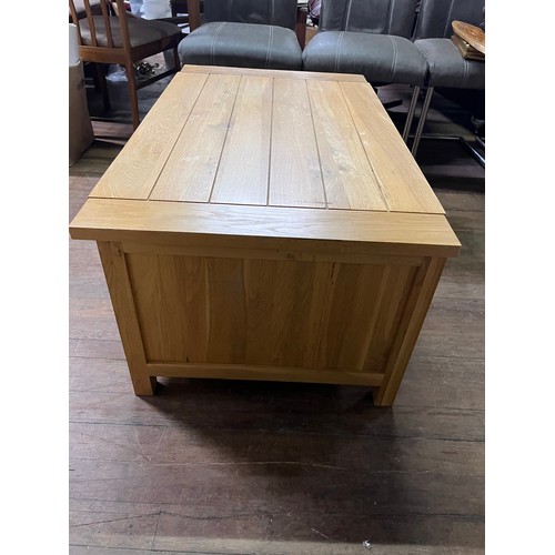 129 - Solid oak 6 drawer coffee table.