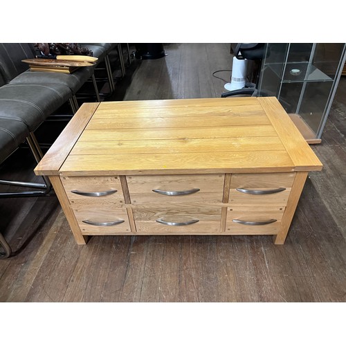 129 - Solid oak 6 drawer coffee table.