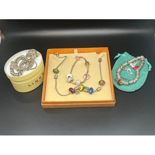 514 - 3 mixed charm bracelets & charm necklace