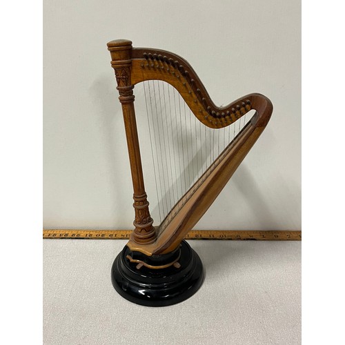 523 - Miniature wooden harp on stand.