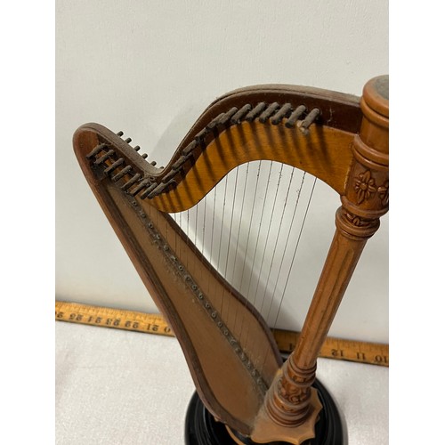 523 - Miniature wooden harp on stand.