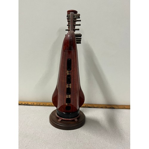 524 - Miniature wooden harp on stand.