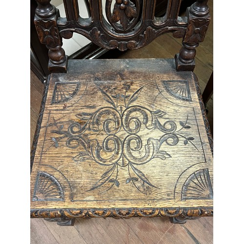 68 - Victorian high back heavily carved hall chair.