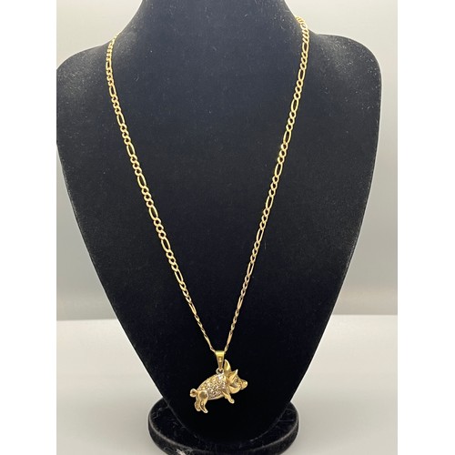 91 - 9ct gold chain with 9ct gold pig 
total weight 23.3 grams
chain 11