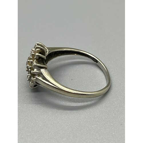 94 - 9ct white gold & diamond cluster ring 2.5grams
