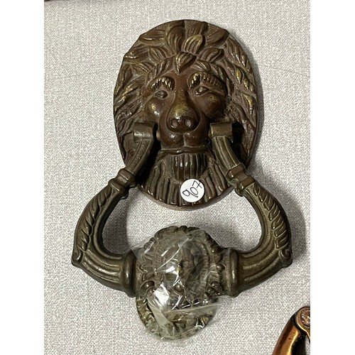 72 - Vintage lion door knocker, tape measure & 2 sets of nutcrackers.