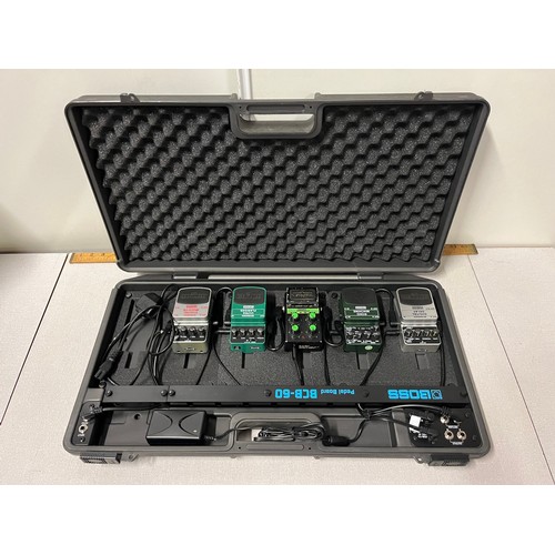 104 - Boss peddle board to include Digital delay, echo machine etc.