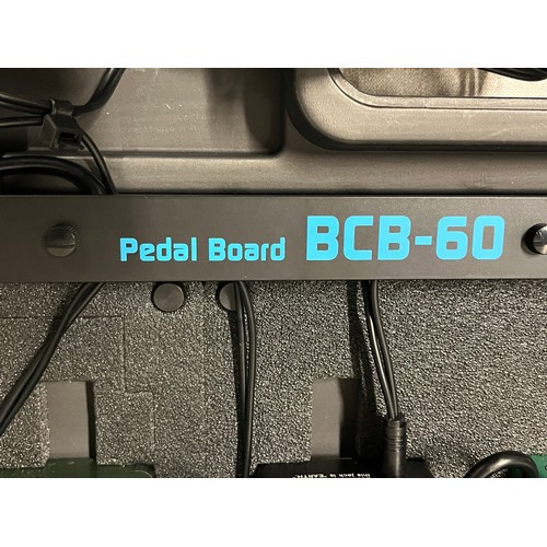 104 - Boss peddle board to include Digital delay, echo machine etc.