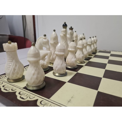 110 - Vintage Soviet carbolite/bakelite black & white chess set USSR to include board.
Tallest 11cm