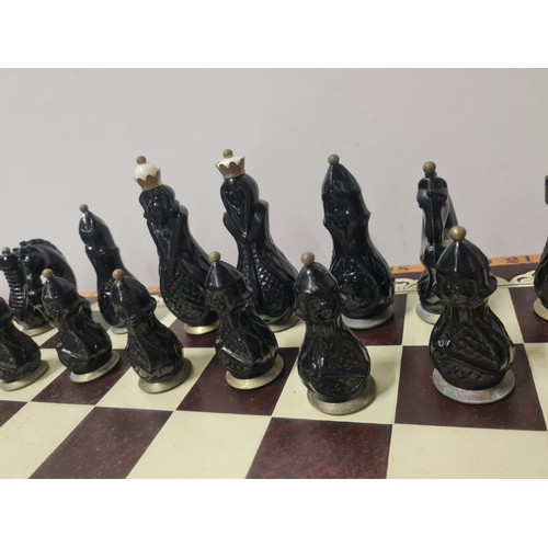 110 - Vintage Soviet carbolite/bakelite black & white chess set USSR to include board.
Tallest 11cm