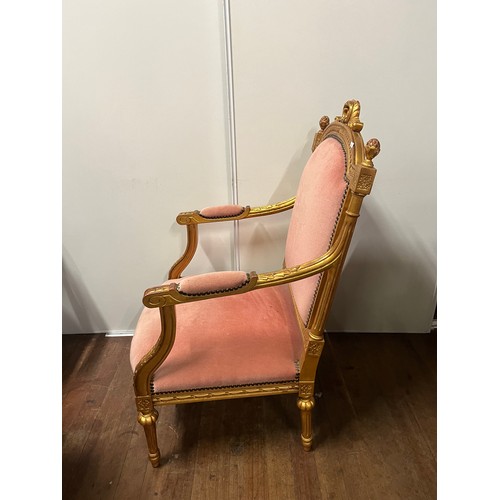 67 - Regency Style lounge arm chair finished with gold leaf to the wood work.