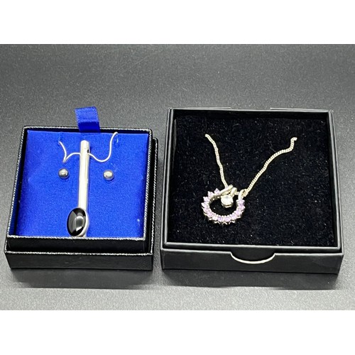 20 - 2 silver chain & pendant sets.