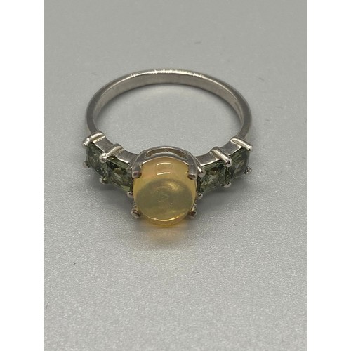 87 - 2 Silver ring with yellow stones.