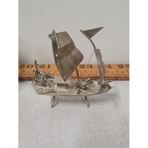 174 - 2 unmarked silver ships.
largest 16cm x 16cm