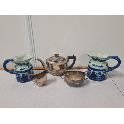 178 - Silver plated tea service with blue & white jugs.