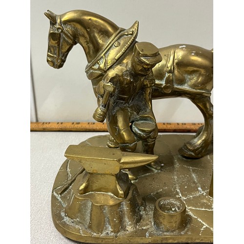 172 - Heavy brass farrier at work ornament
25cm long