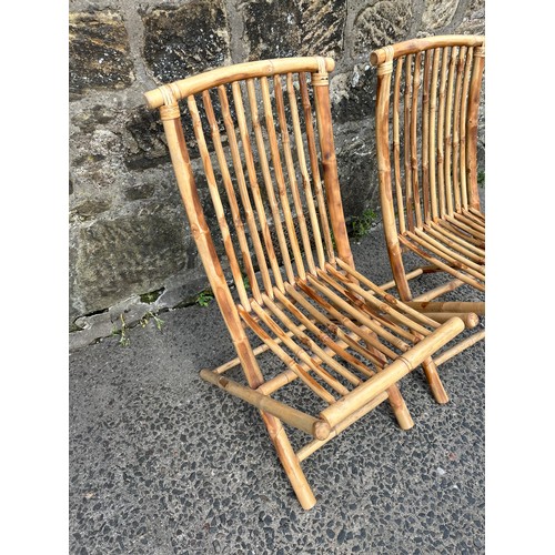 13 - a pair of vintage folding bamboo chairs