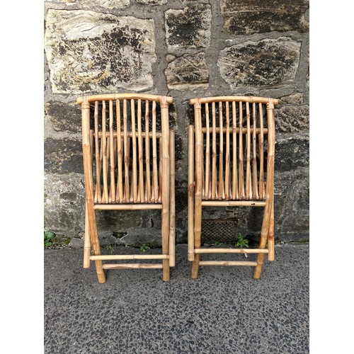 13 - a pair of vintage folding bamboo chairs