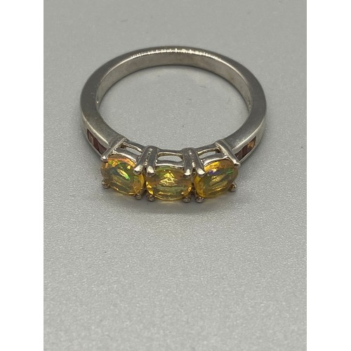 87 - 2 Silver ring with yellow stones.