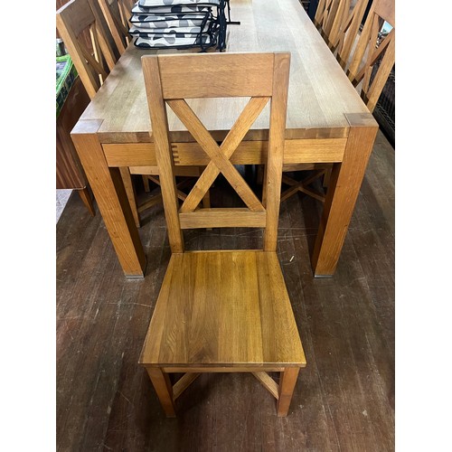 232 - large solid oak table with 8 chairs , top shows signs of ware 200x101x78cm