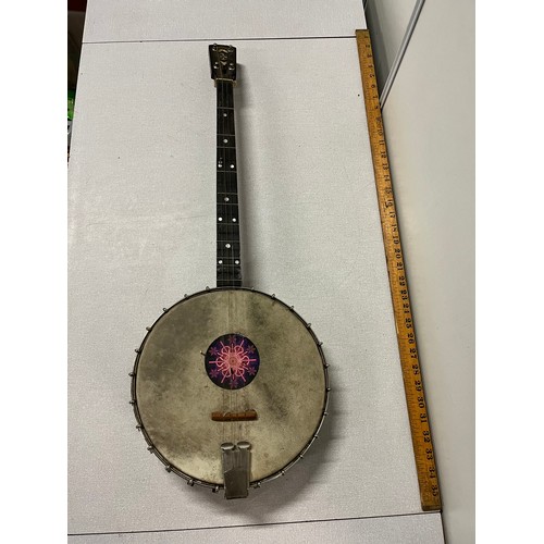 152 - 4 string banjo with decorative white metal back.