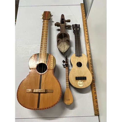 153 - 4 x stringed instruments to include Antique Nepali Sarangi etc.