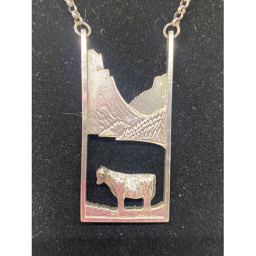 20 - Silver chain with large heavy Scottish silver cow pendant