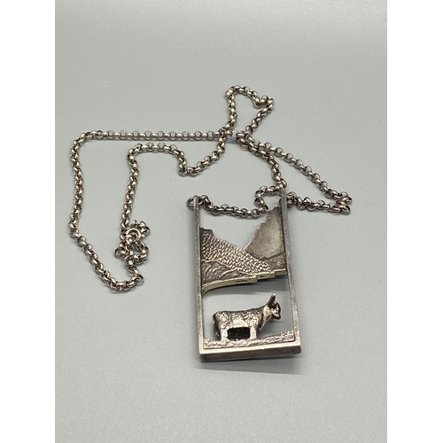 20 - Silver chain with large heavy Scottish silver cow pendant