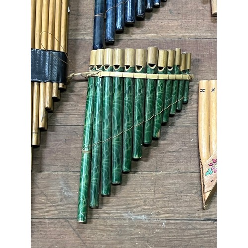 56 - Large collection of pan pipes/flutes,