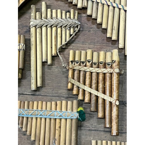 56 - Large collection of pan pipes/flutes,