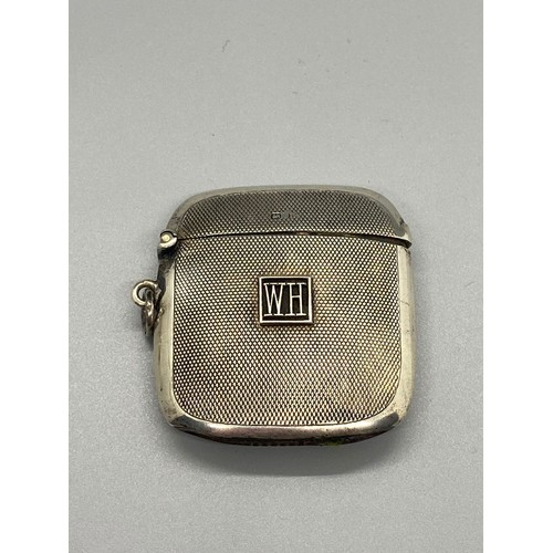 90 - silver hallmarked vesta case with  WH emblem on the front